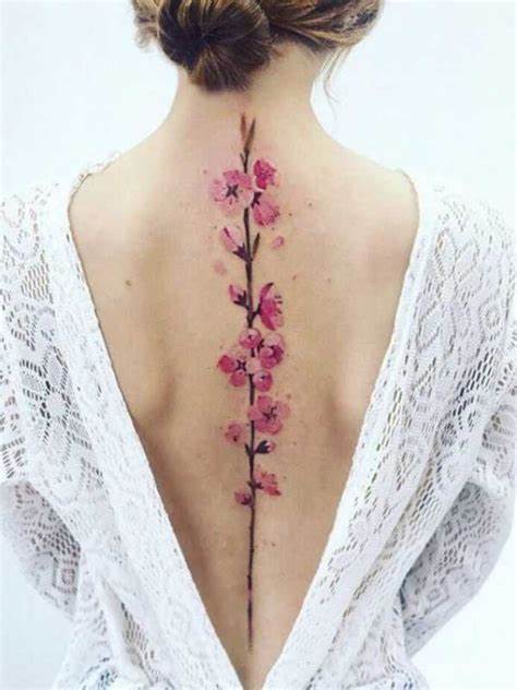 32 Spine Tattoo Ideas for Enchanted Looking Back 14 Cherry blossom spine tattoo