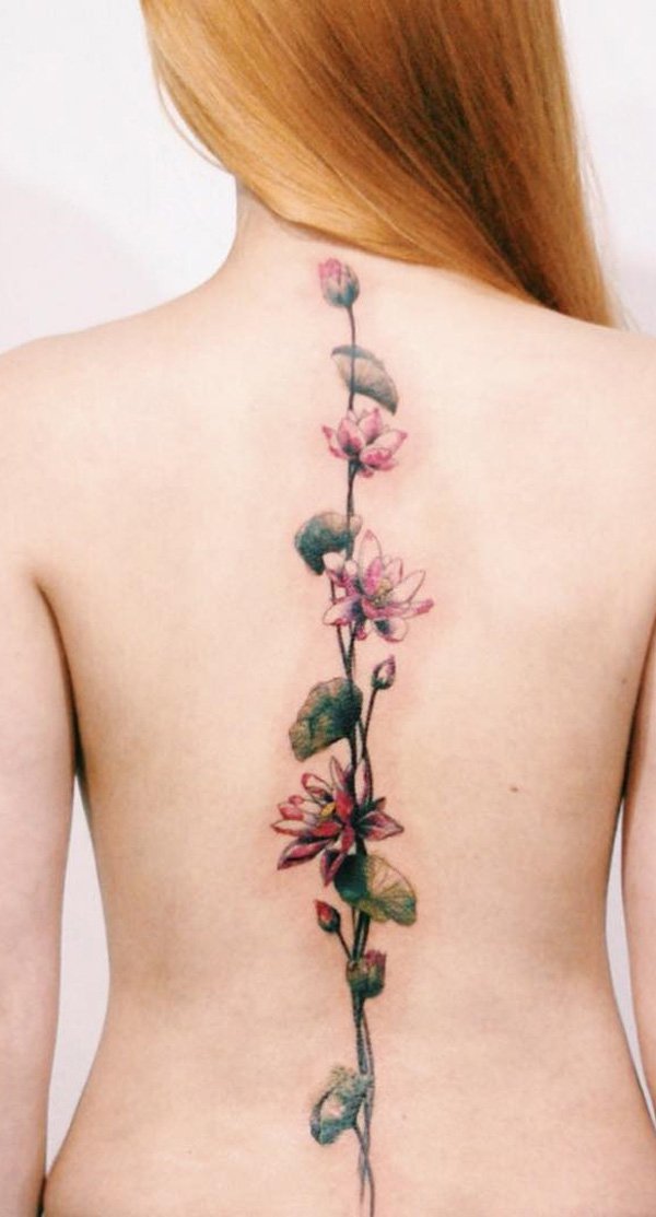 32 Spine Tattoo Ideas for Enchanted Looking Back 11 Lotus flower spine tattoo