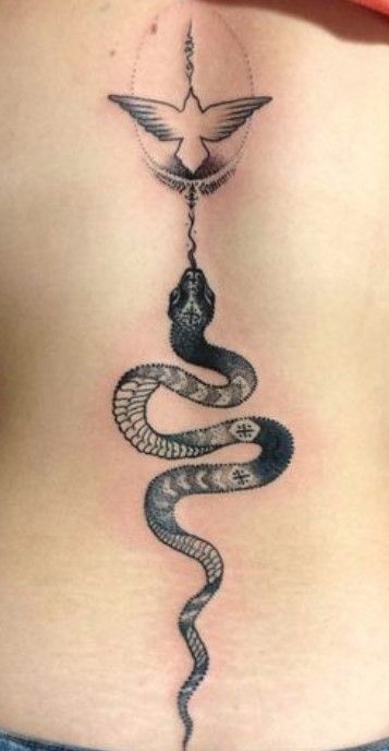32 Spine Tattoo Ideas for Enchanted Looking Back 18 Snake spine tattoo