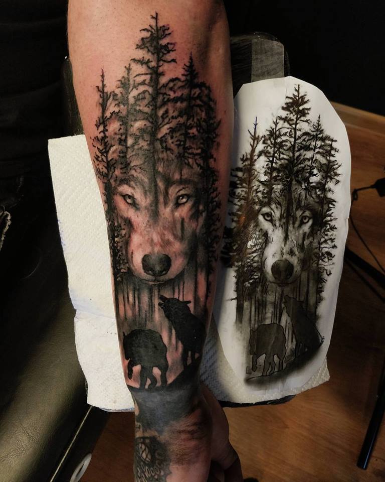 35 Wolf Tattoo Ideas- Inked Predators: The Grace and Strength of Wolf Tattoos 19 Forest Wolf Tattoo