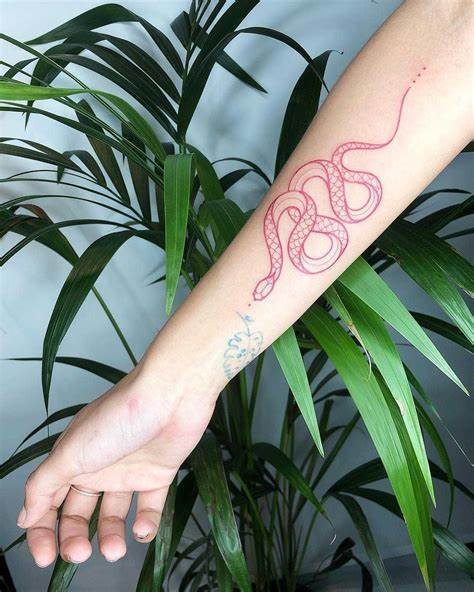 30 Latest Snake Tattoo Ideas - Pick Your Favorite Style 10 10. Woman's Forearm with a Red Linework Snake Tattoo