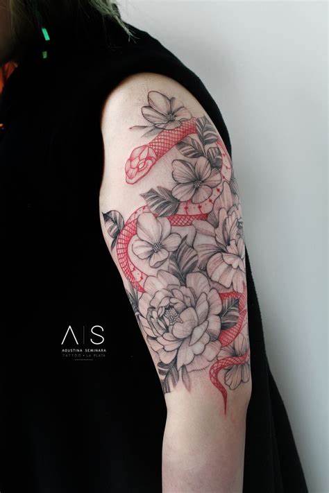 30 Latest Snake Tattoo Ideas - Pick Your Favorite Style 13 A Woman with a Red Floral Snake on Her Back