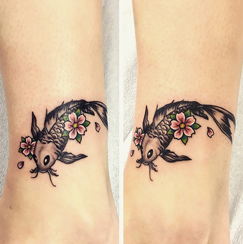 Fish, flowers, and butterflies tattoo