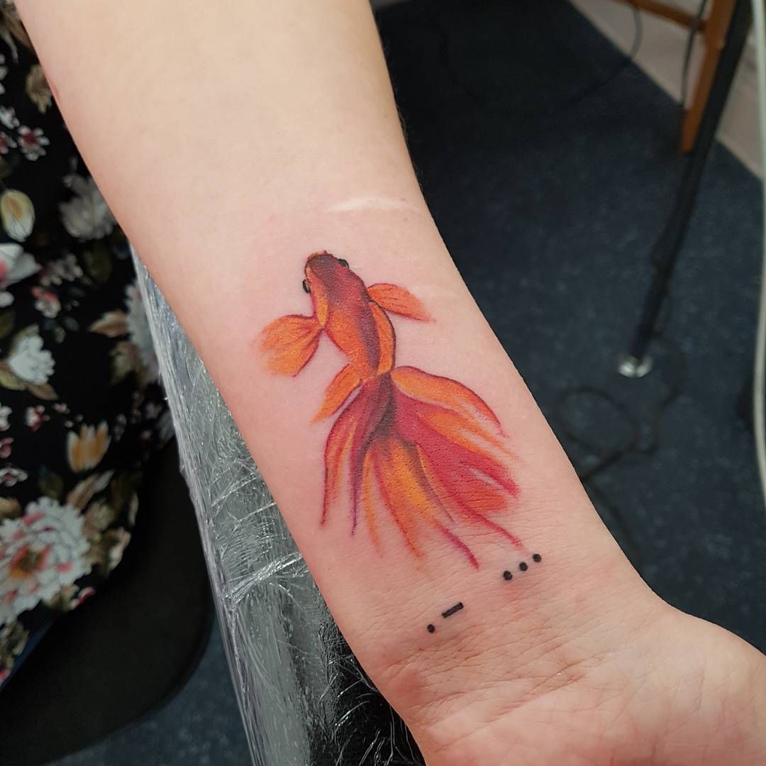 Fish Tattoo Designs for Marine Life Lovers - 31 Captivating Ideas 13 Goldfish Tattoo