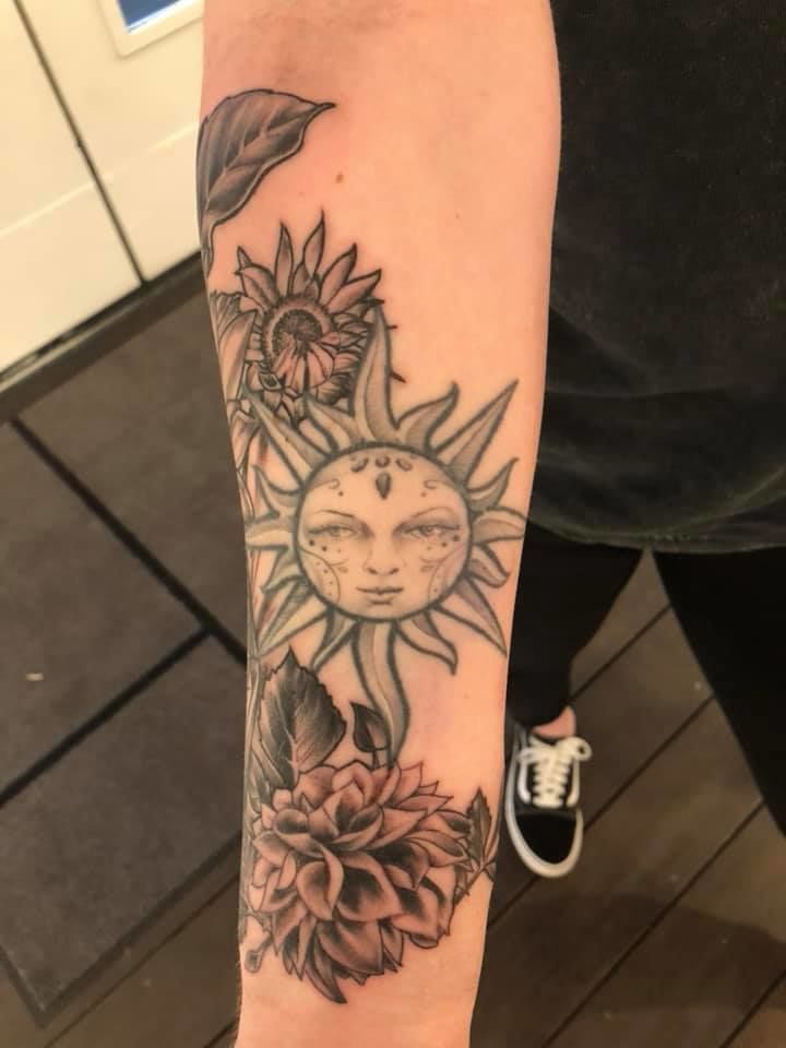 31 Mesmerizing Sun Tattoo Designs for Fierce and Unstoppable Individuals 6 Plant Sun Tattoo