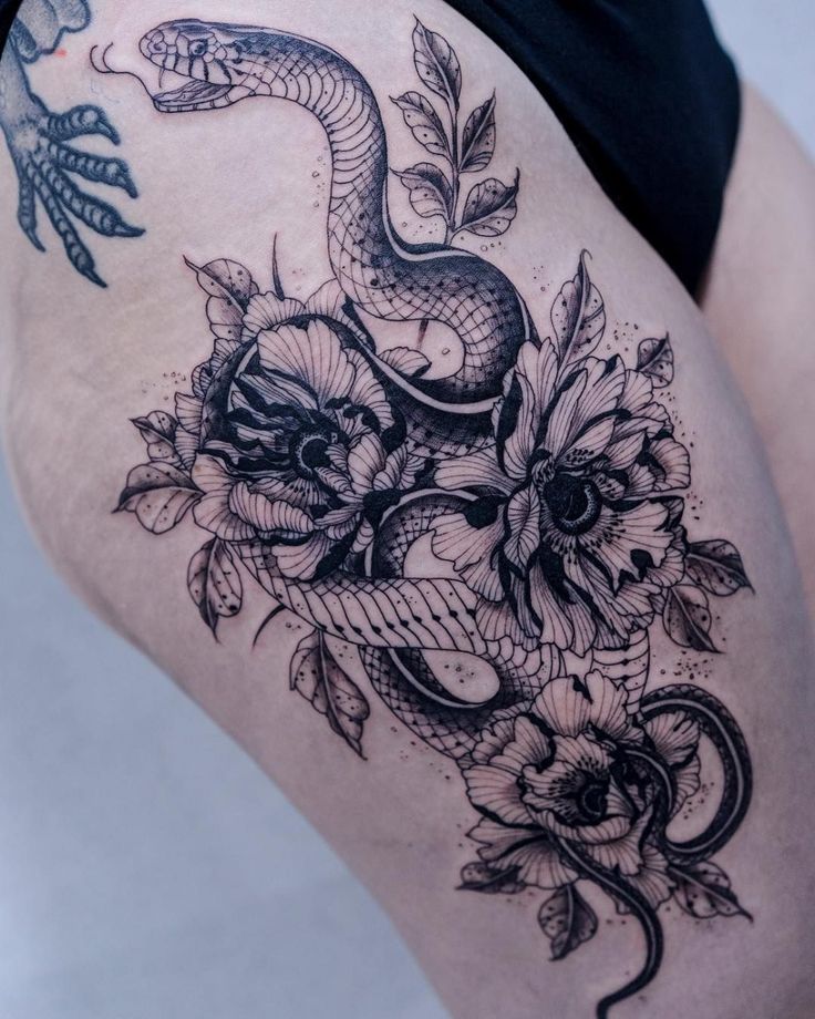 30 Latest Snake Tattoo Ideas - Pick Your Favorite Style 14 Tattoo of a Floral Snake on a Woman's Ribs