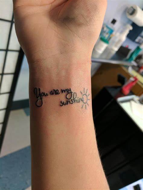 31 Mesmerizing Sun Tattoo Designs for Fierce and Unstoppable Individuals 11 You are my sunshine tattoo