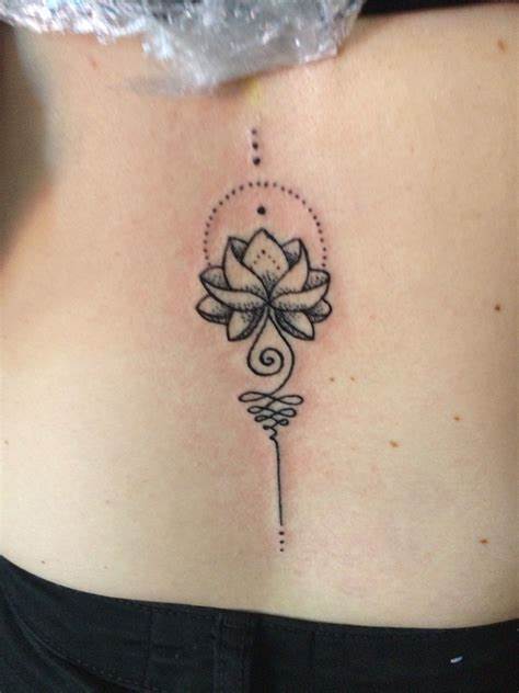 Lotus Tramp Stamp Tattoo