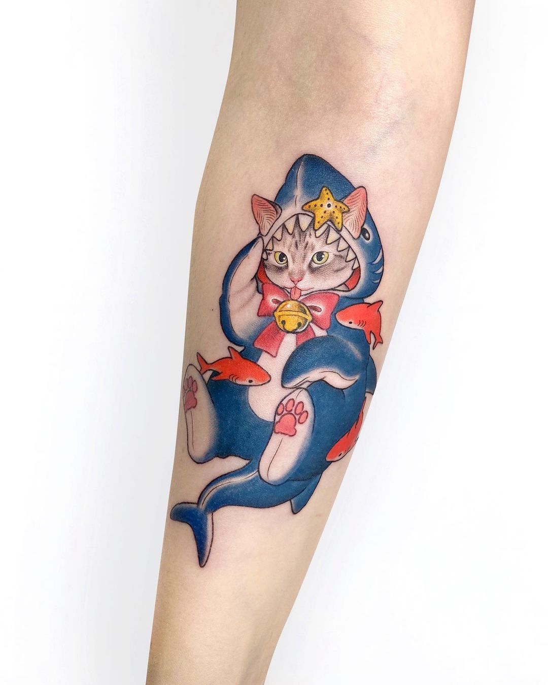 18. A Cat In A Sharks Costume Tattoo Design