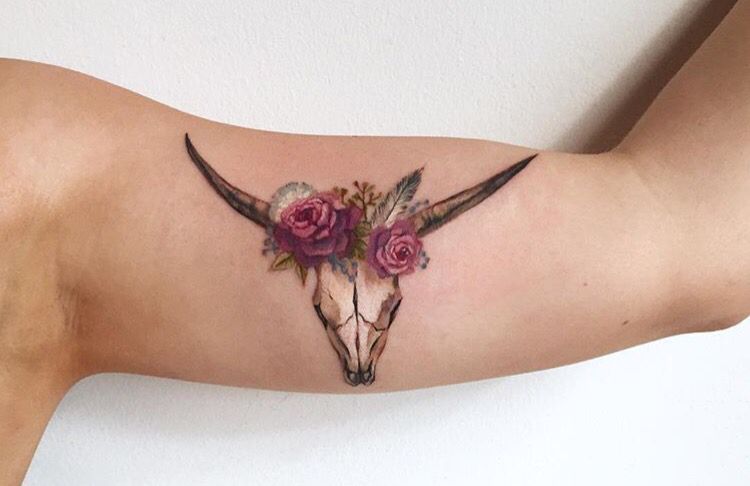 Tattoo of a Taurus and a Poppy
