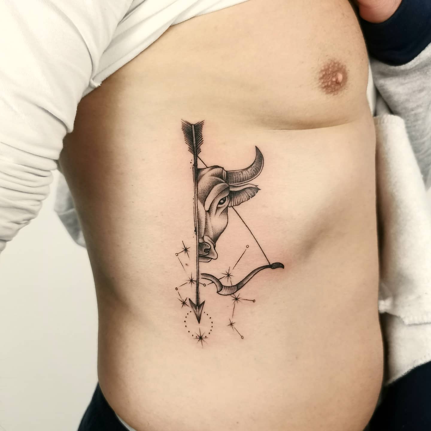 bow and arrow taurus tattoo