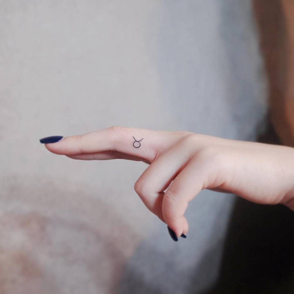 finger taurus tattoo
