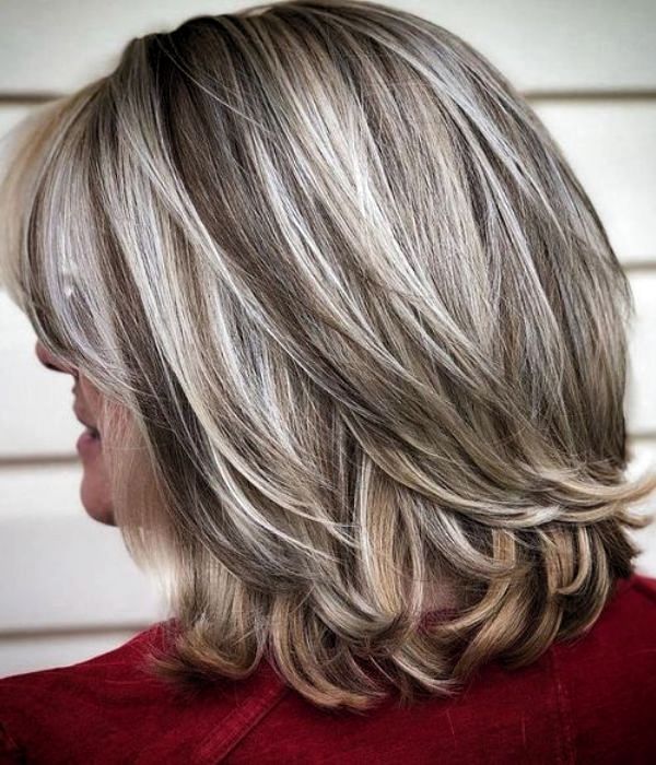 A grey bob with swoopy layers