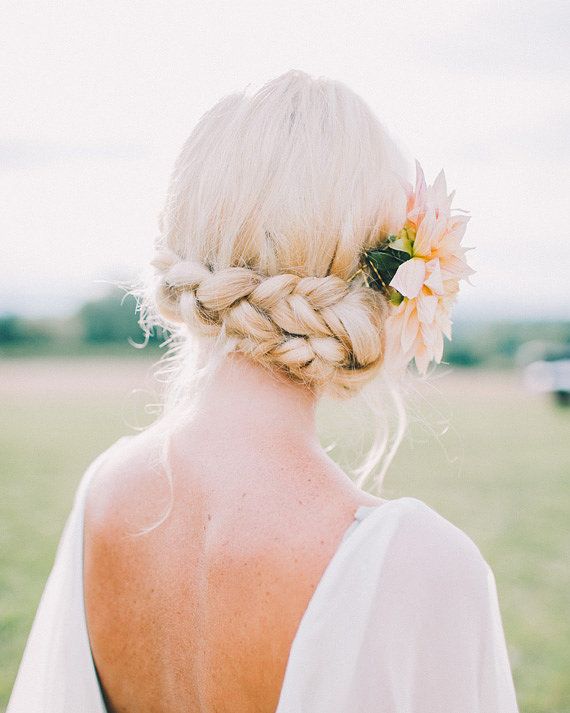 Braided updo with floral accessories