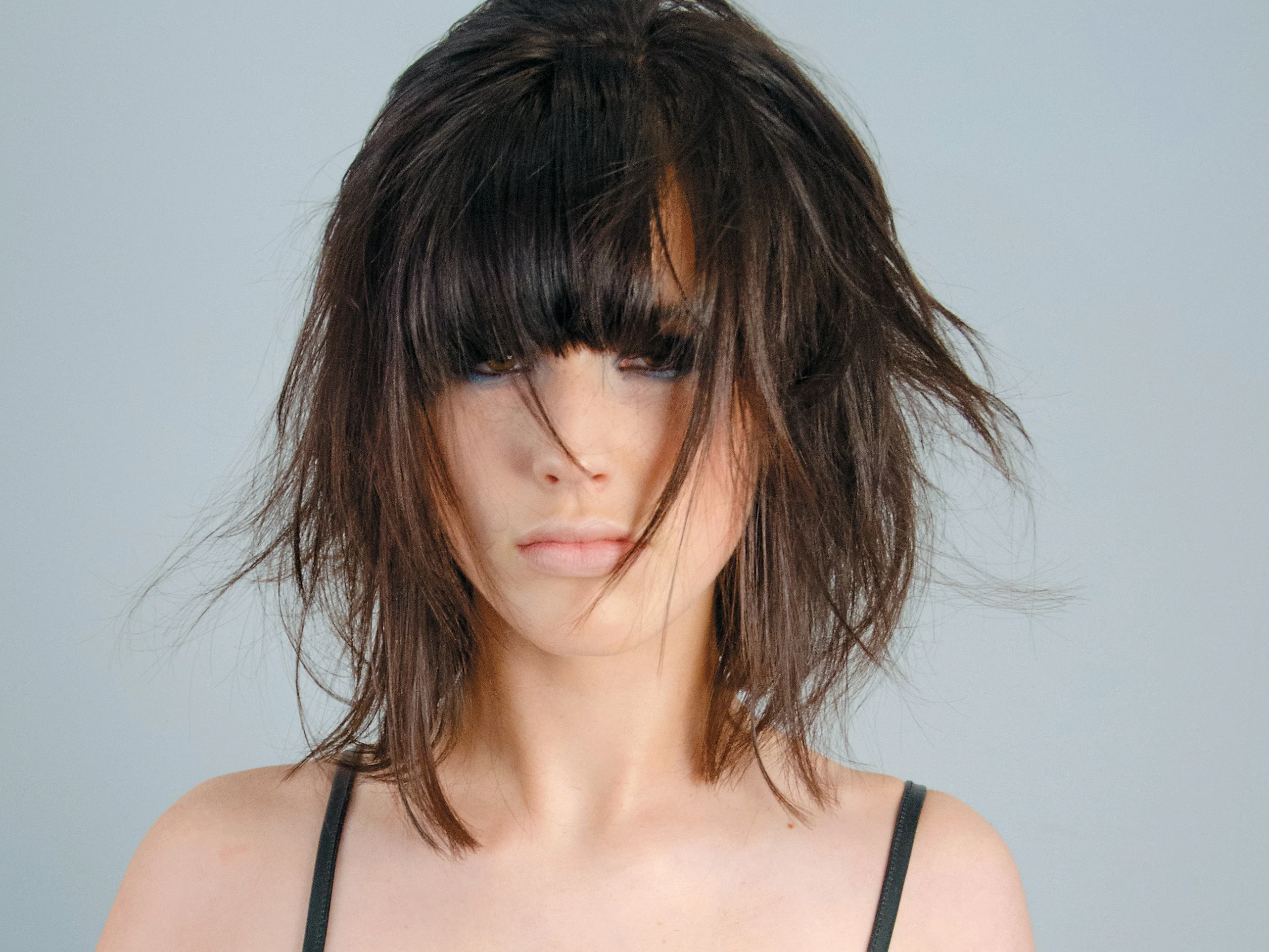 Messy and Asymmetrical Hair Strands Hairstyle