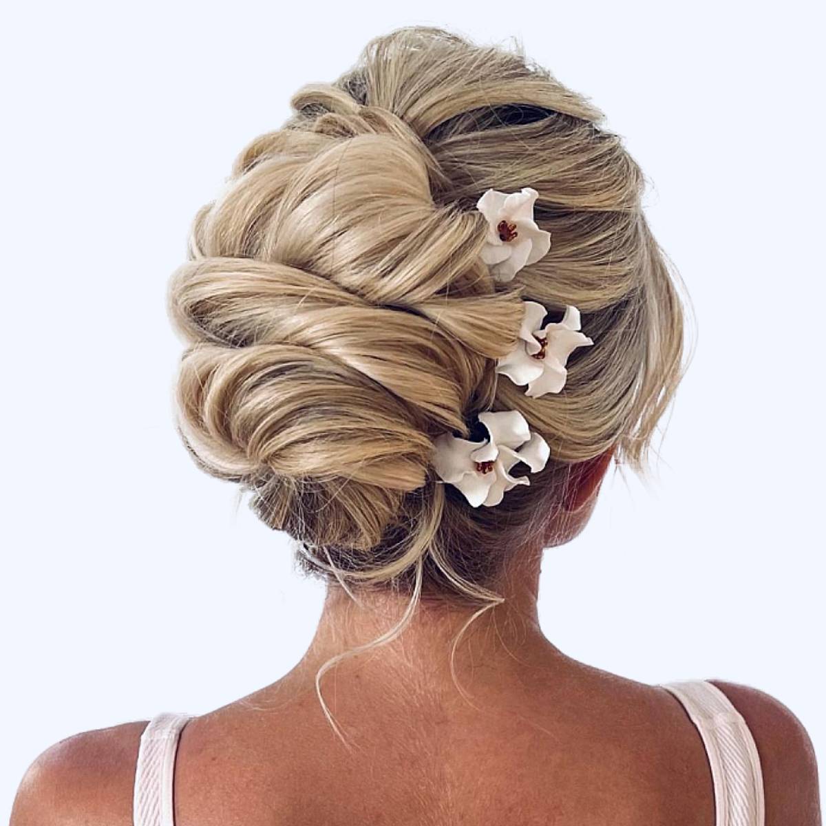 Elongated Twisted Updo with Flowers