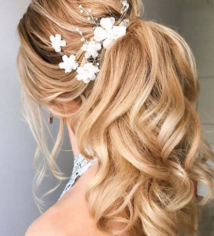 Bridal Beachy Waves with a High Ponytail and a Floral Brooch