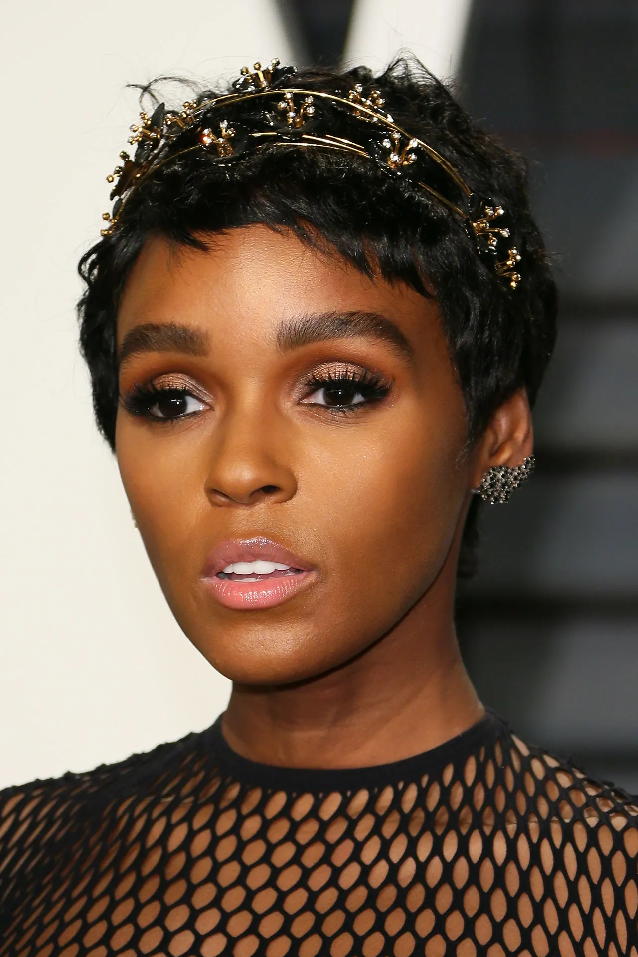 Dark-colored Pixie with a Metallic Headpiece
