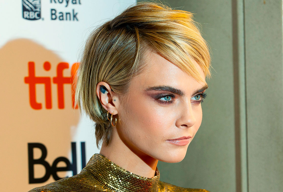 Ear-tucked Golden-Blonde Pixie with Side-swept Bangs