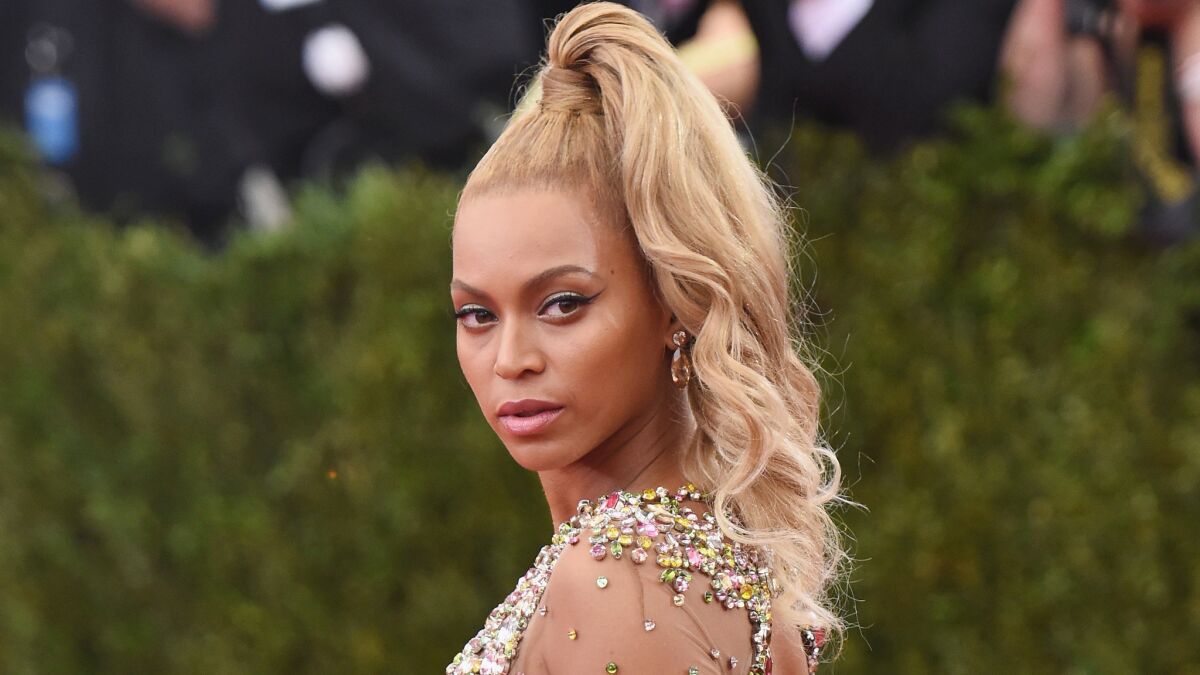 A Blonde, High and Side-Swept Ponytail