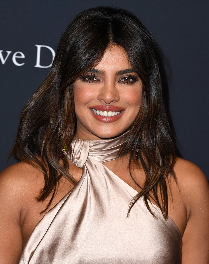 Mid-parted Face-framing Layered Hairstyle