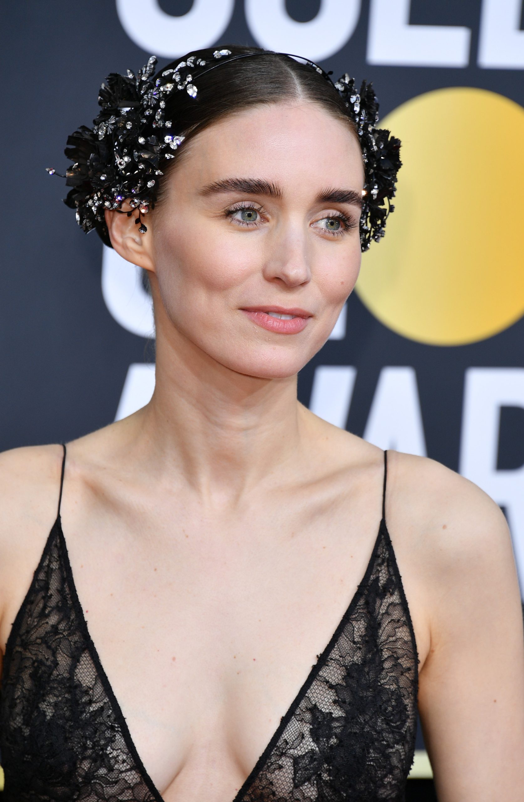 Sleek and Mid-parted Bun with a Fancy Headband