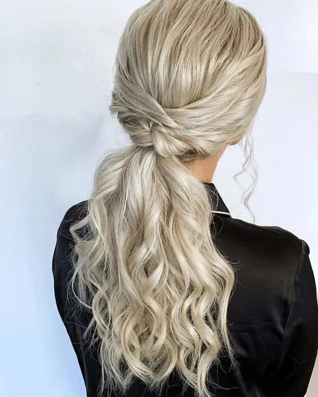 Twisted low ponytail with side part