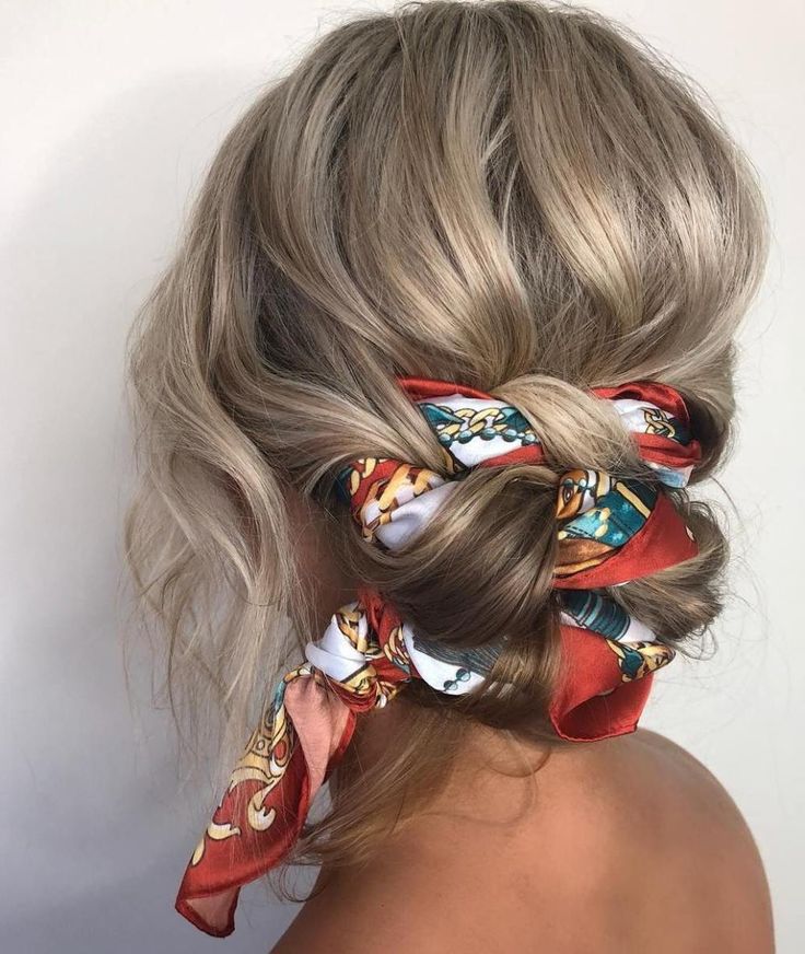 Messy braided updo with a scarf wrap
