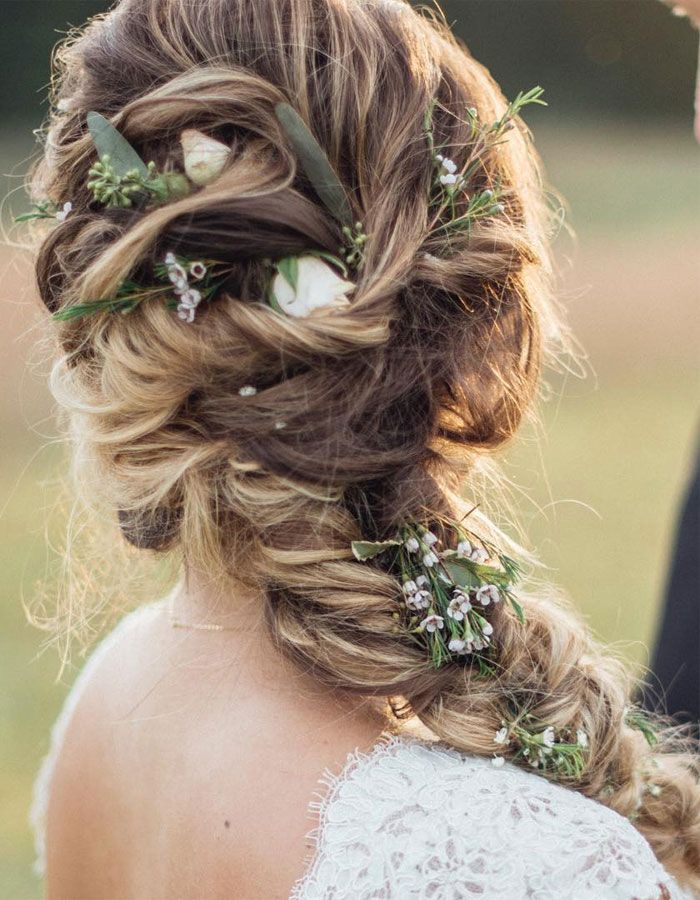 Side-swept braid with flower accents