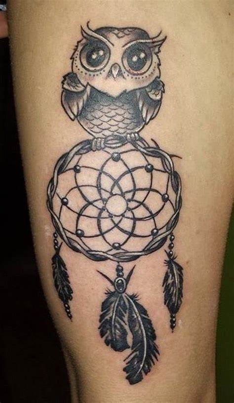 Tattoo of an owl with a dream-catcher