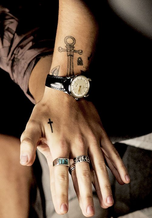 A Guide to More than 51 Tattoos That Harry Styles Has - For All the Harries Out There 11 cross