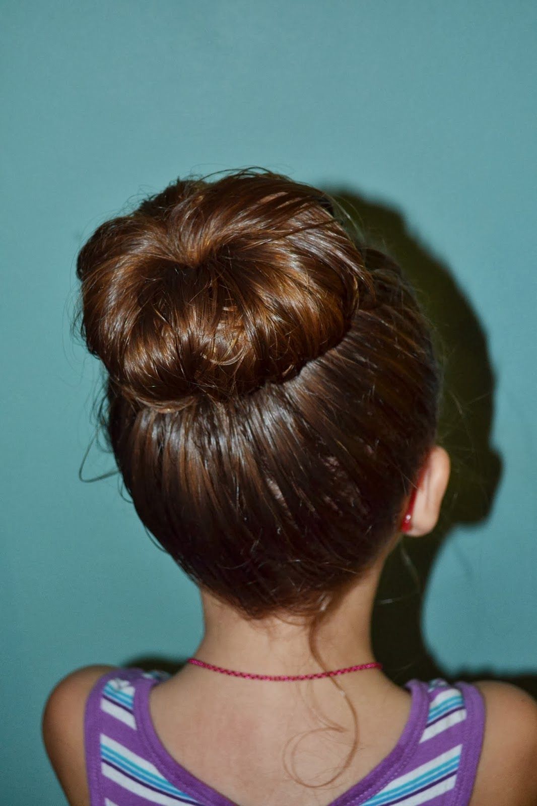 Quick and Cute: 25 Easy Hairstyles for School Girls 9 Sock Bun Hairstyle for school