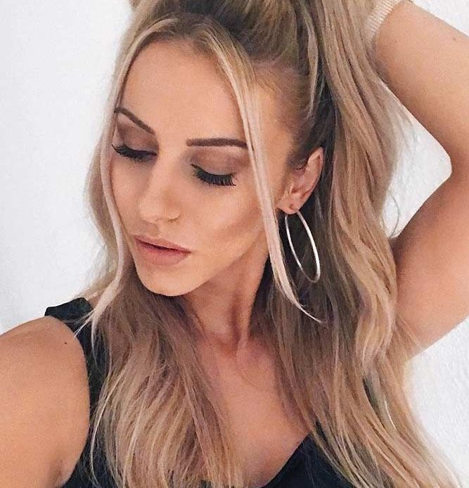 20 Half Up Half Down Hairstyles you'll love 1 Bouncy Ponytail Half Up Half Down Hairstyle