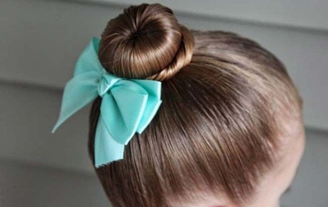 No Fuss Hairstyles For Kids - Even Mom Can Do These! 18 Sock Bun with a bow Hairstyle For Kids