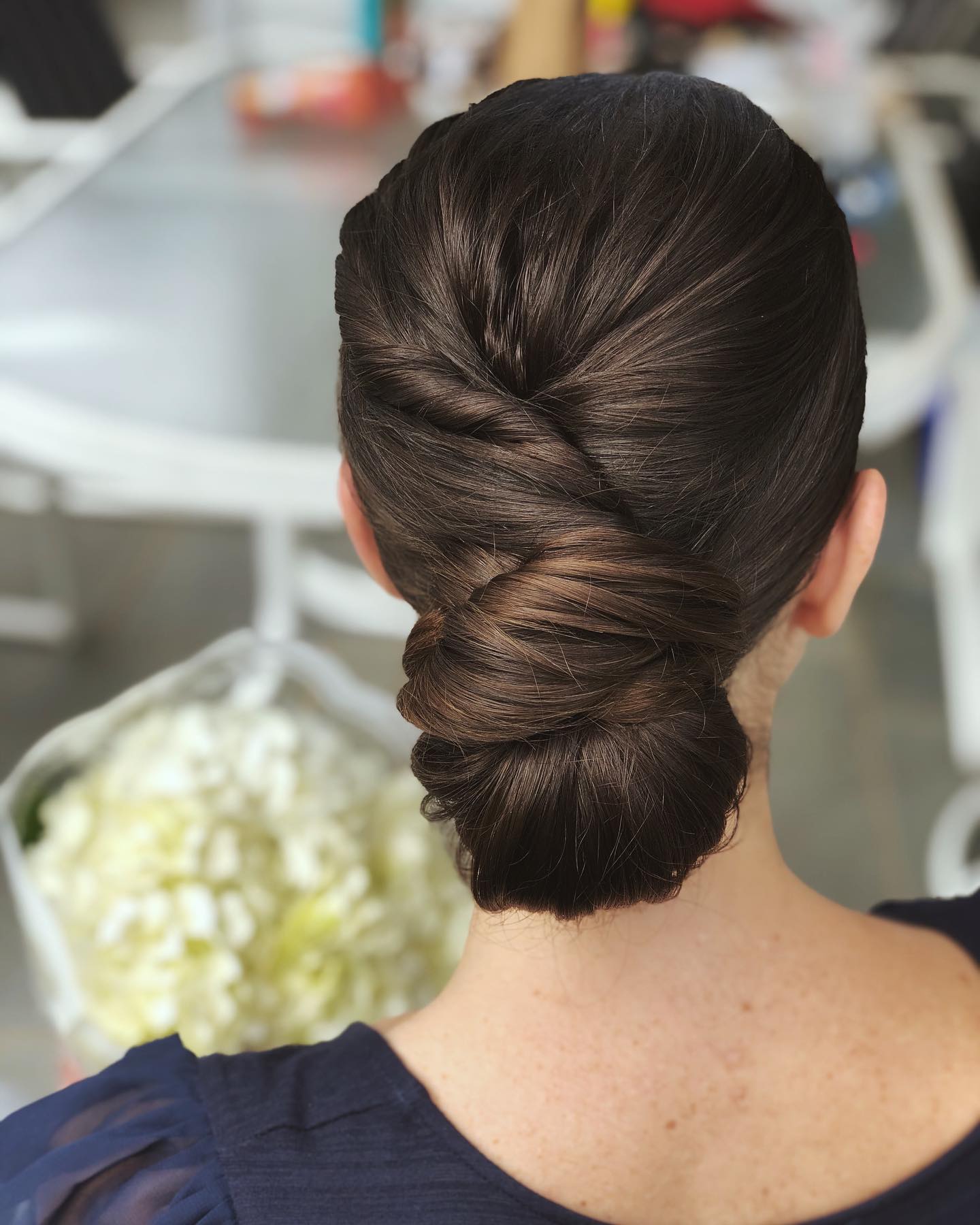 Rolled-in Bridal Hair with a Twisted Updo